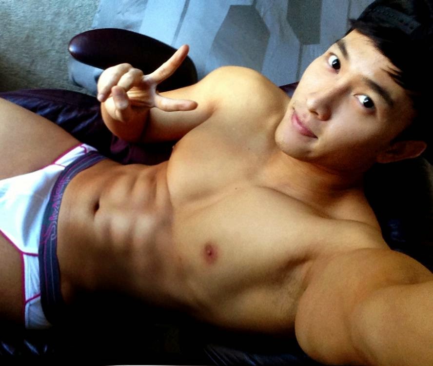Asian guy posing in playgirl